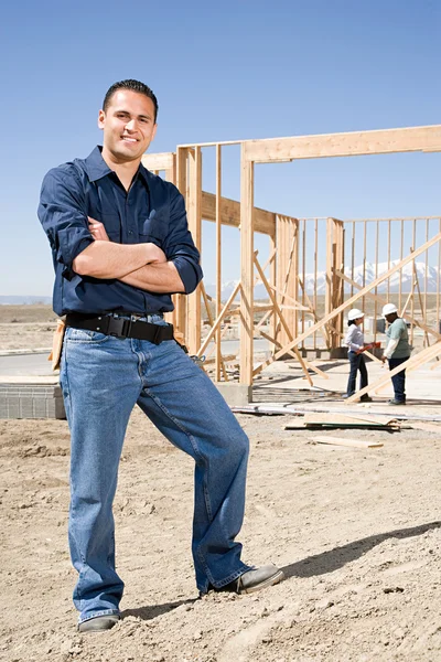 Builder near construction site — Stock Photo, Image