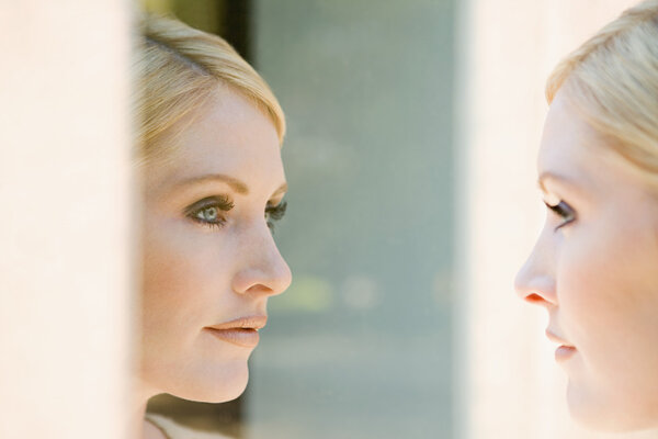 Woman looking at her reflection