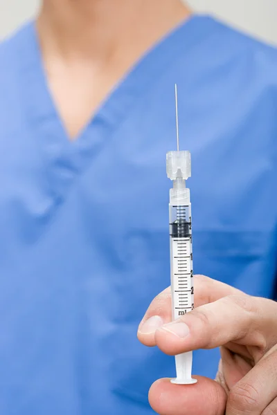 Doctor with syringe in her hand — Stock Photo, Image