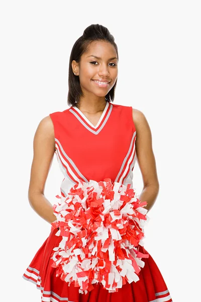 Cheerleader ler mot kameran — Stockfoto