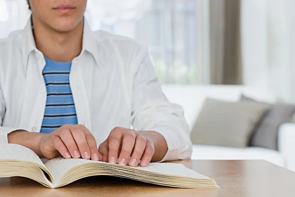 Blind boy reading a braille book — Stock Photo, Image