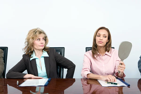 Vain businesswoman with mirror — Stock Photo, Image