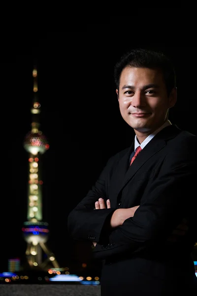 Empresário e a torre de pérolas oriental — Fotografia de Stock