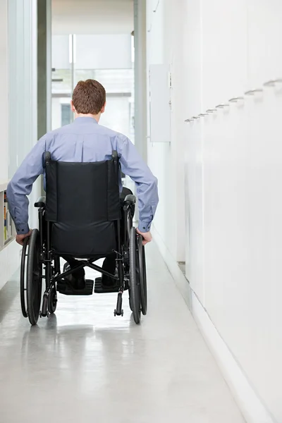 Rear view of a man in a wheelchair — Stock Photo, Image