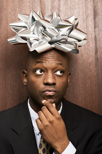 Businessman with bow on his head — Stock Photo, Image