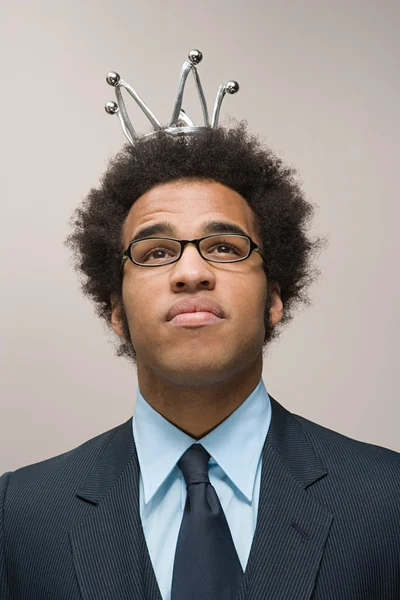 Office worker wearing a crown — Stock Photo, Image