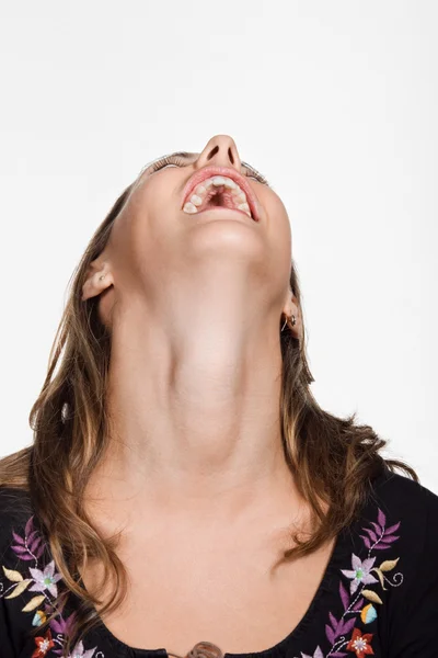 Young woman with her head back laughing — Stock Photo, Image