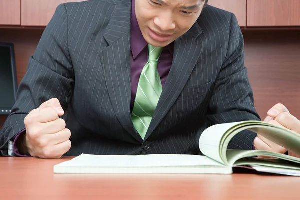 Stressed asian businessman working — Stock Photo, Image