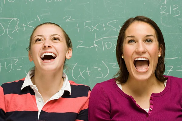 Two female students showing surprise — Stock Photo, Image