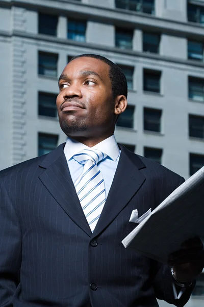 Businessman with newspaper — Stock Photo, Image