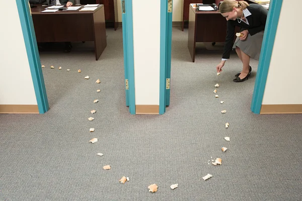 Woman placing trail of bread — Stock Photo, Image