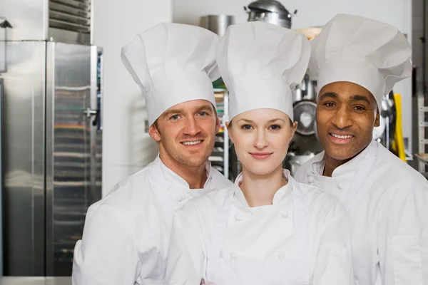Chefs smiling at camera — Stock Photo, Image