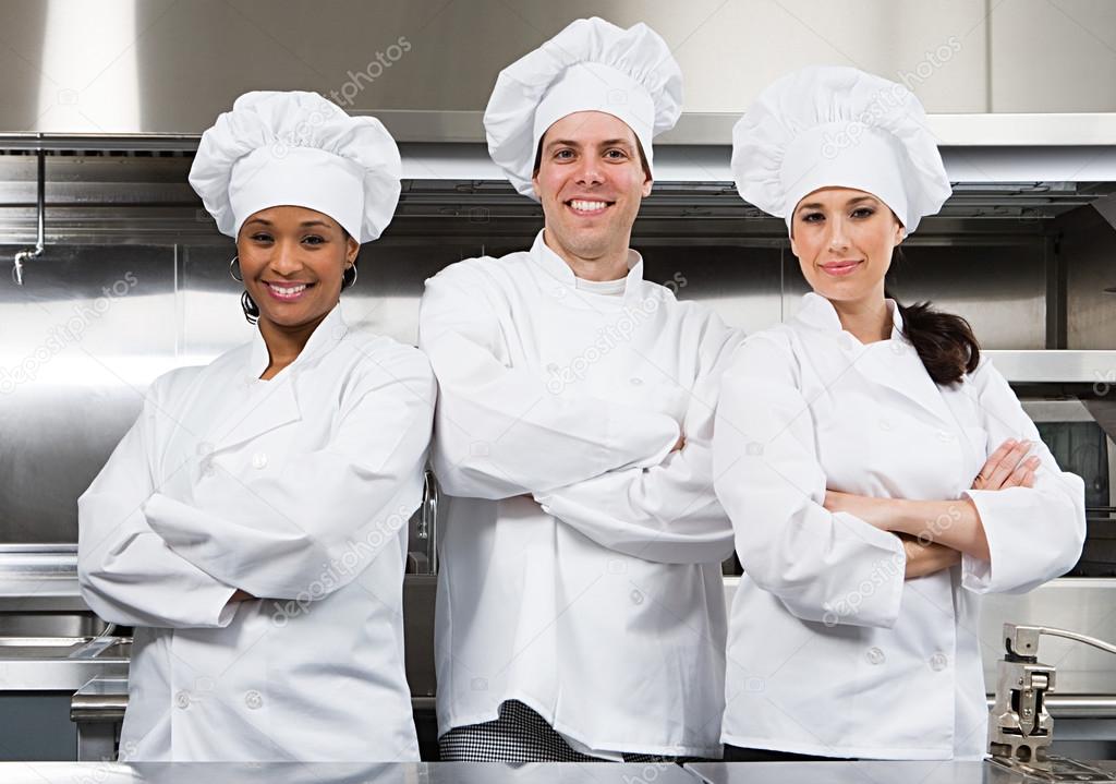 Three chefs on kitchen Stock Photo by ©XiXinXing 94000784
