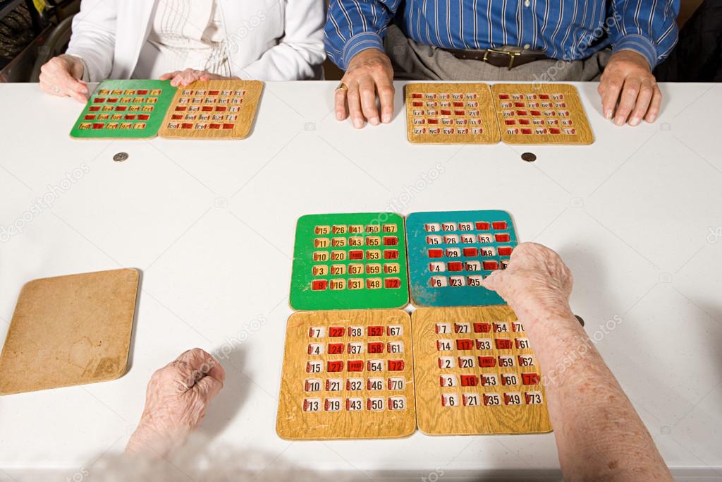 Three seniors playing bingo