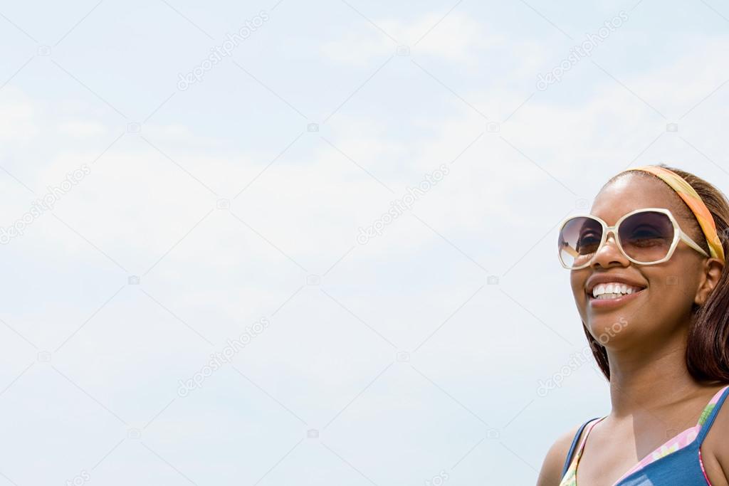 Woman wearing sunglasses smiling