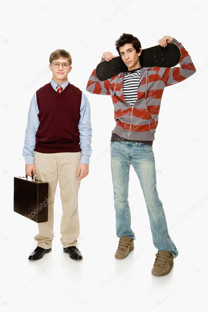 Geek and skater boys posing