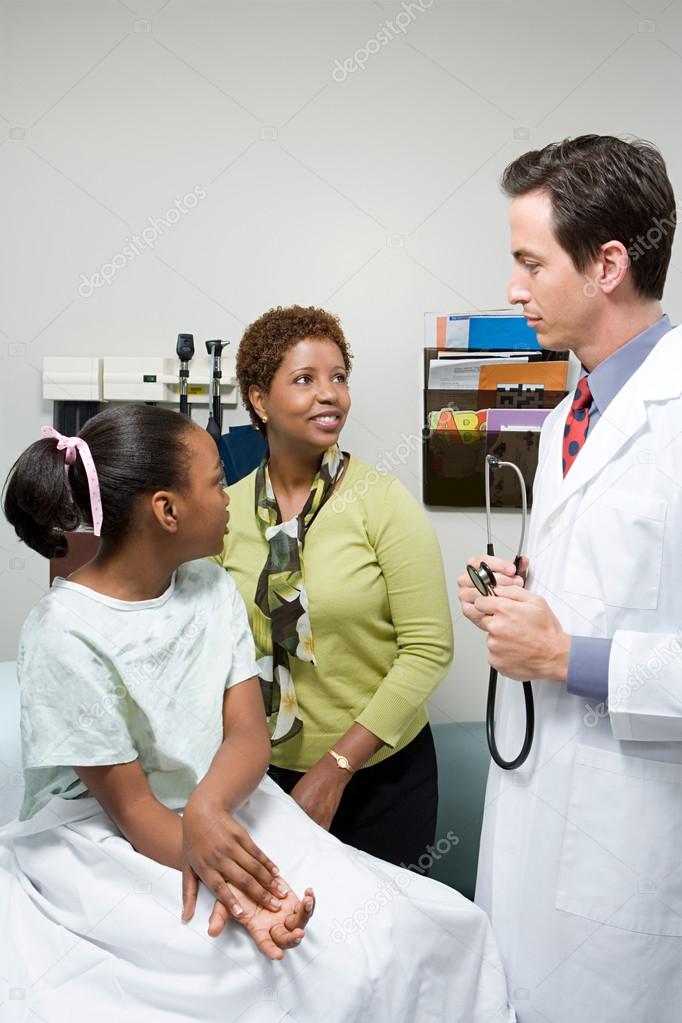 Doctor with mother and daughter