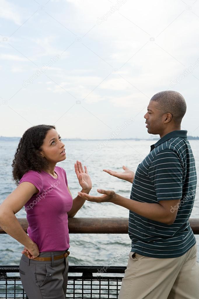 Couple arguing near river