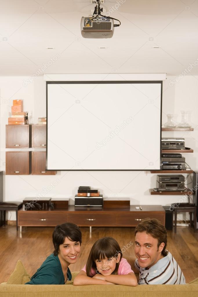 Family in living room smiling