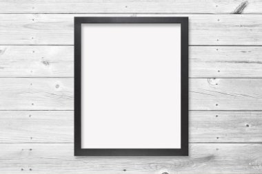 4x5 ratio black frame hanging on a cool wood plank wall. Contains clipping path to make it easier to add artwork behind the frame.. 