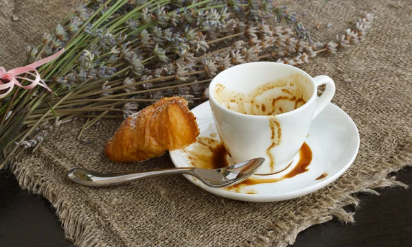 A cup of finished espresso coffee on a sackcloth — Stock Photo, Image