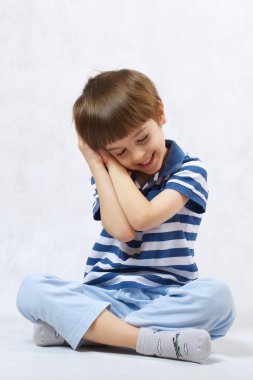 A boy is thinking about something dear to him clipart