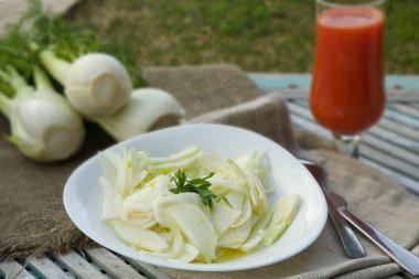 Fresh fennel salad with lemon juice, olive oil and parsley clipart
