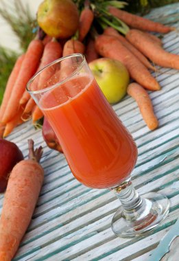 A glass of fresh apple carrot juice clipart
