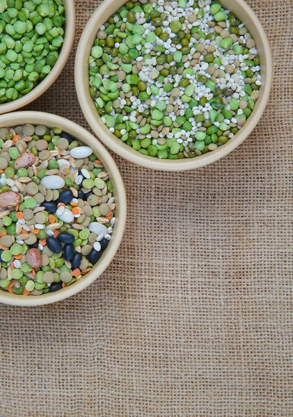 An assortment of legumes and cereals on a sackcloth — Stock Photo, Image