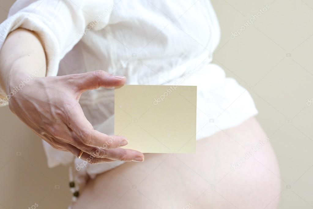 A card with a gap in the hand of pregnant