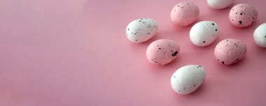 Pink easter banner, decorative eggs. Copy space for text. Easter ornament