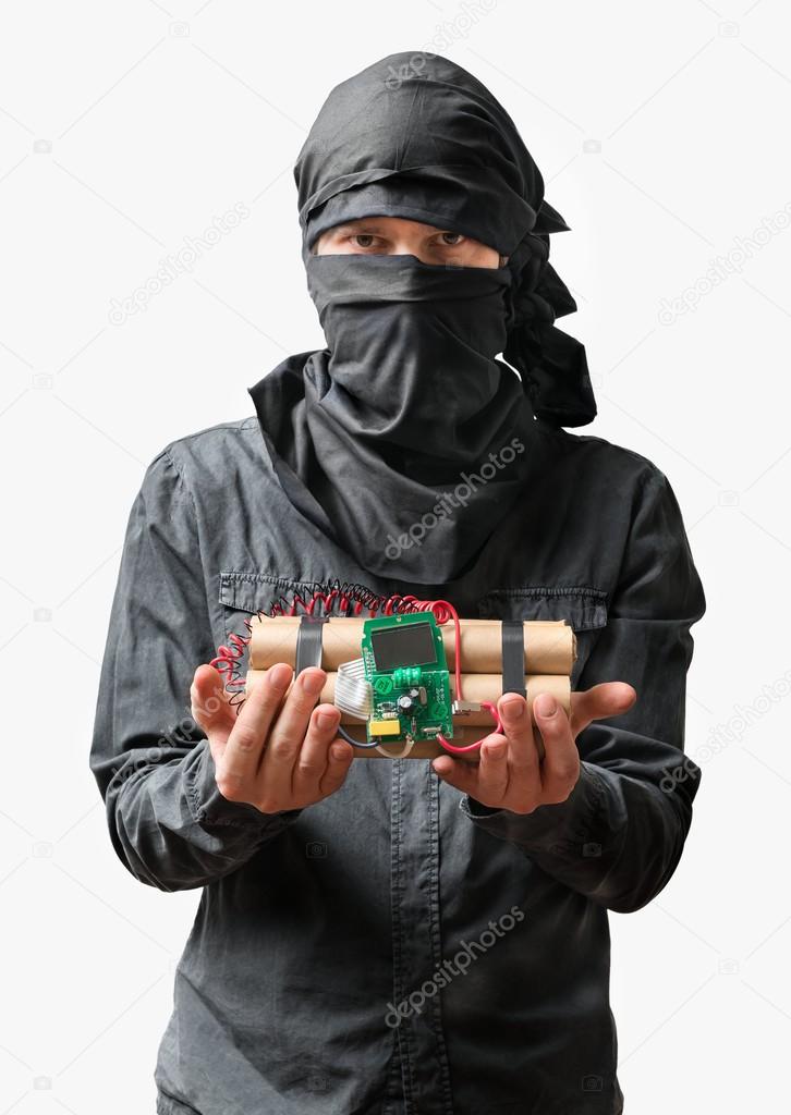 Terrorist holds dynamite bomb in hand. Isolated on white background.