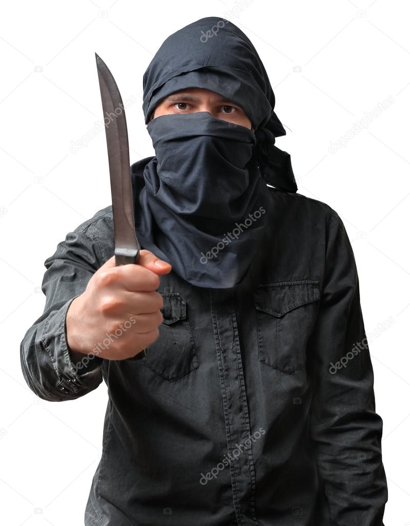 Terrorism concept. Terrorist threatening with knife. Isolated on white background.