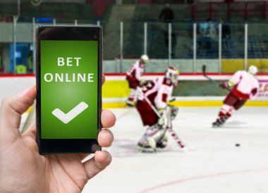Adam ICO hokey izliyor ve smartphone online bahis.