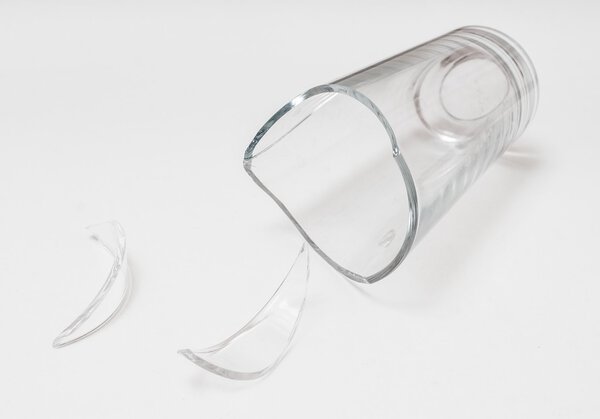 Broken glass for drinking. Isolated on white background.