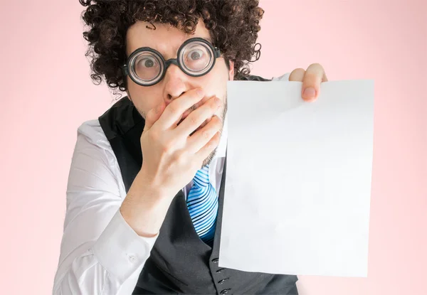 Top view on disappointed businessman showing blank empty paper as frame for custom message. — Stock Photo, Image