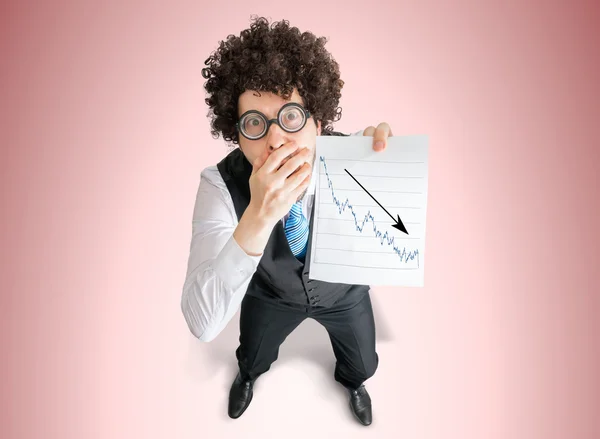 Disappointed businessman is showing chart of bad investment and loss progress. — Stock Photo, Image