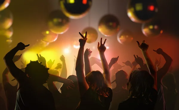 Nightlife and disco concept. Young people are dancing in club. — Stock Photo, Image