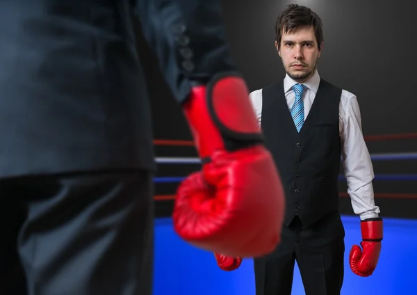 Businessman is boxing with his boss in ring. — Stock Photo, Image