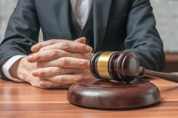 Justice and Law concept. Lawyer has clasped hands and gavel in front. — Stock Photo, Image