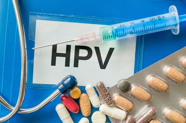 HPV virus desease concept. Many pills, syringe and stethoscope around. — Stock Image HPV virus desease concept. Many pills, syringe and stethoscope around. Stock Photo