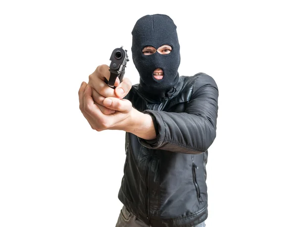 Robbery in store. Robber is aiming and threatening with gun in shop. Stock  Photo