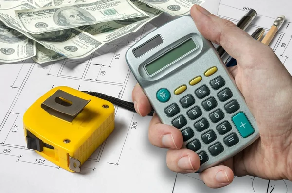 Man is calculating money and funds for his architectural project — Stock Photo, Image