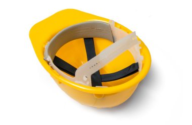 Beyaz arka plan üzerinde izole sarı plastik kask. Baş aşağı.