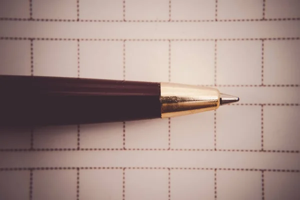 Manuscript paper and a ballpoint pen