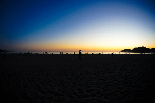 Dusk and the people of the silhouette of Kamakura coast