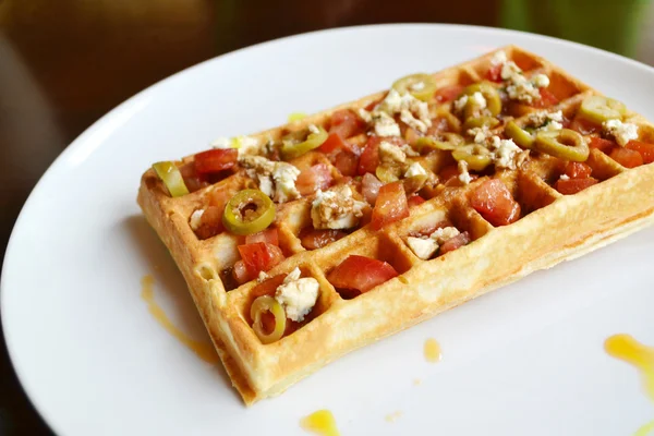 Belgian waffle with tomatoes, cheese and olives — Stock Photo, Image