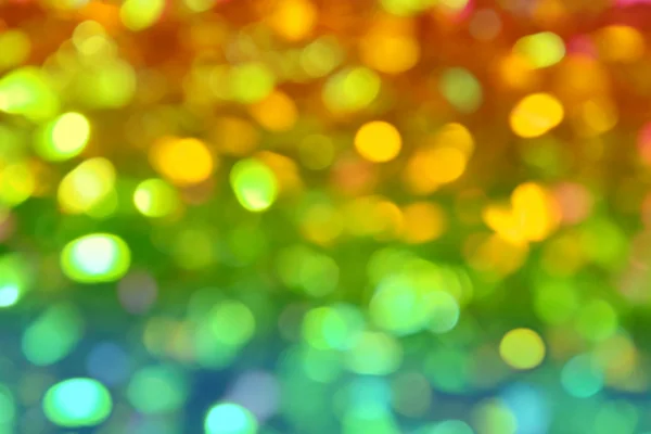 Brilhante e abstrato desfocado colorido arco-íris fundo com brilho cintilante — Fotografia de Stock