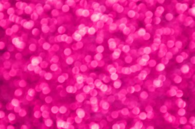 Parıldayan ile parlak ve soyut pembe arka plan bulanık glitter