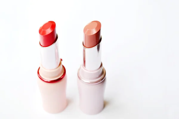 Set de lápiz labial rosa y rojo aislado sobre blanco — Foto de Stock